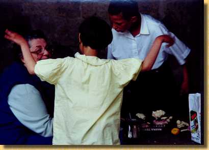 Barb and two children learning English